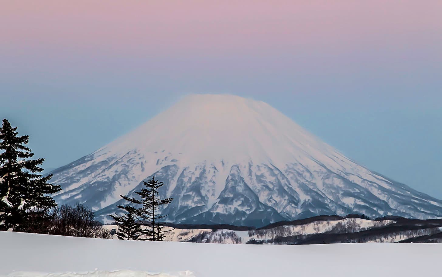 Mount Yotei in the evening before sunset Land of Ride team ready to ski it