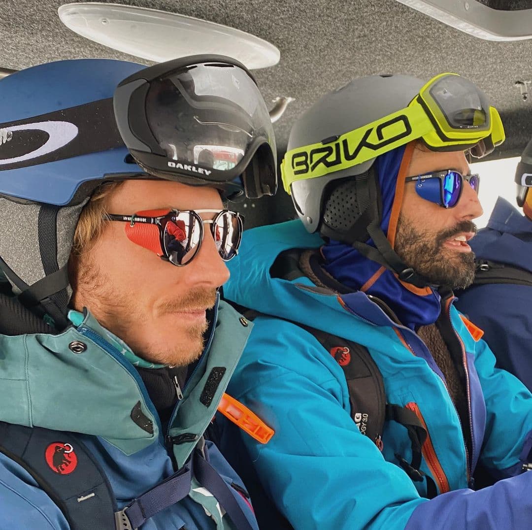 Two friends inside a catski in Georgia ready to go skiing.