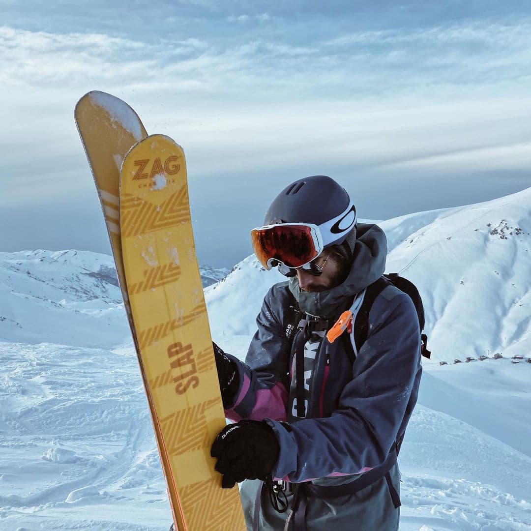 Man in Georgia holding powder Skis Slap 121