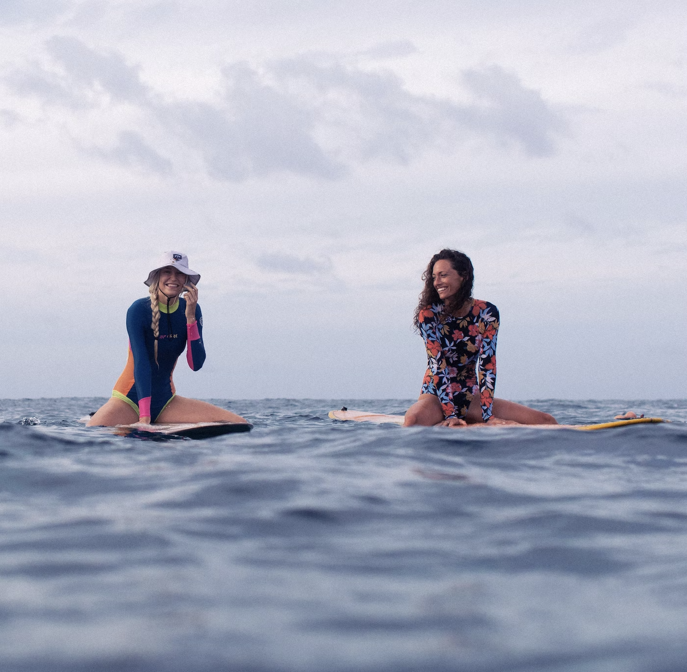 Kunna Haan and Kate surfing in the Maldives with Land of Ride