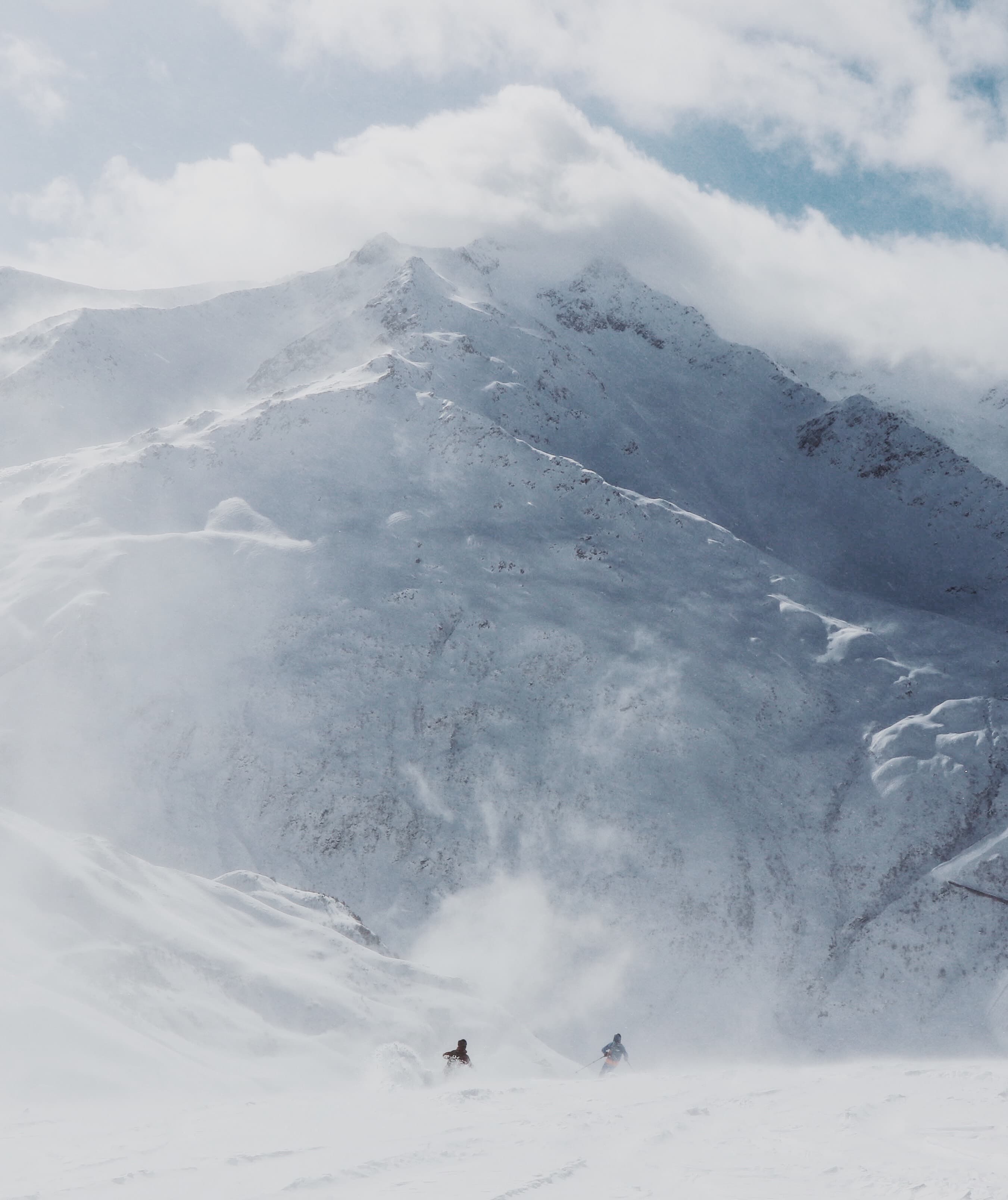 Two people skiing off-piste with mountain view in Georgia