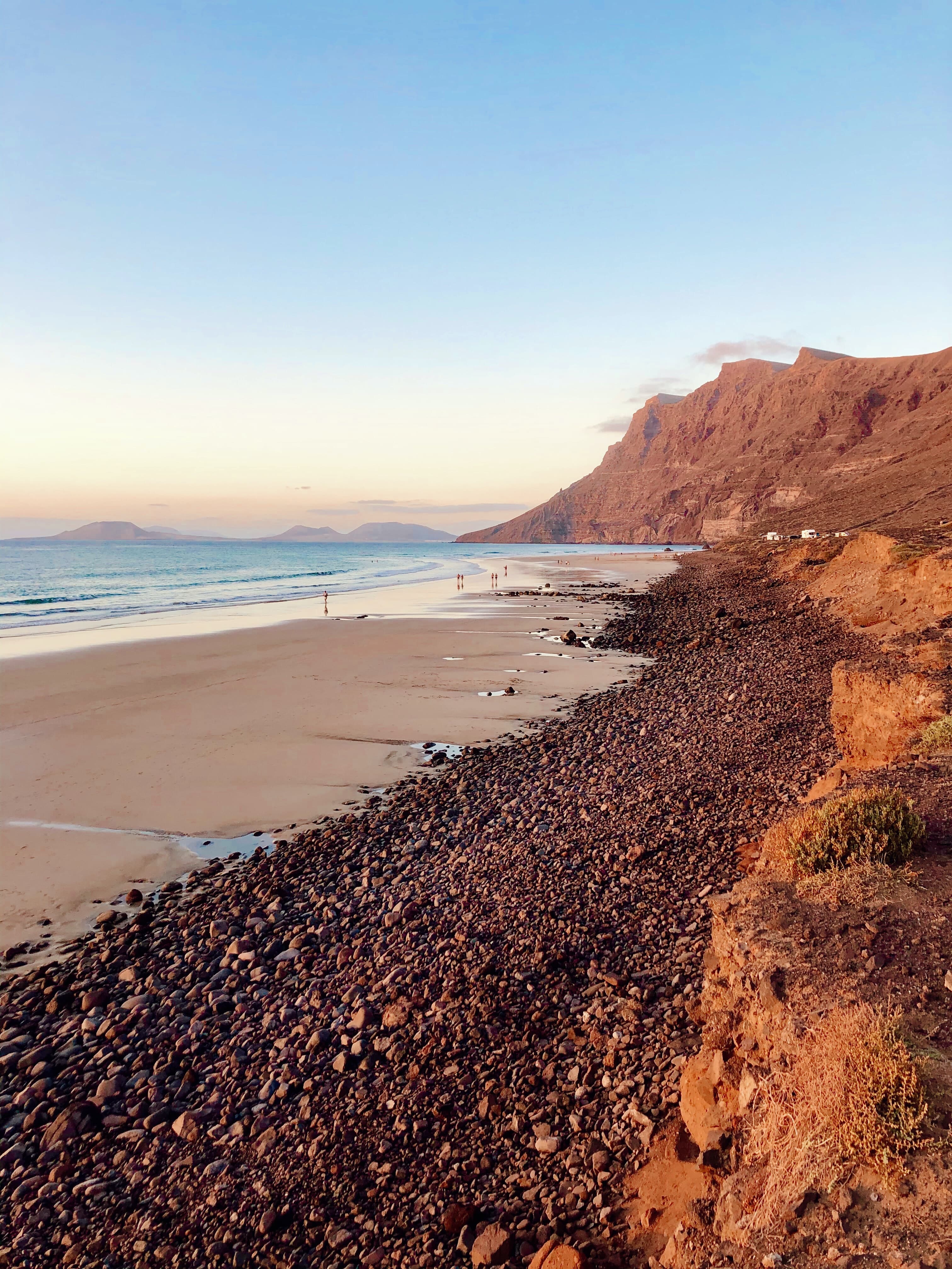Photo of the beach of Famara at sunset