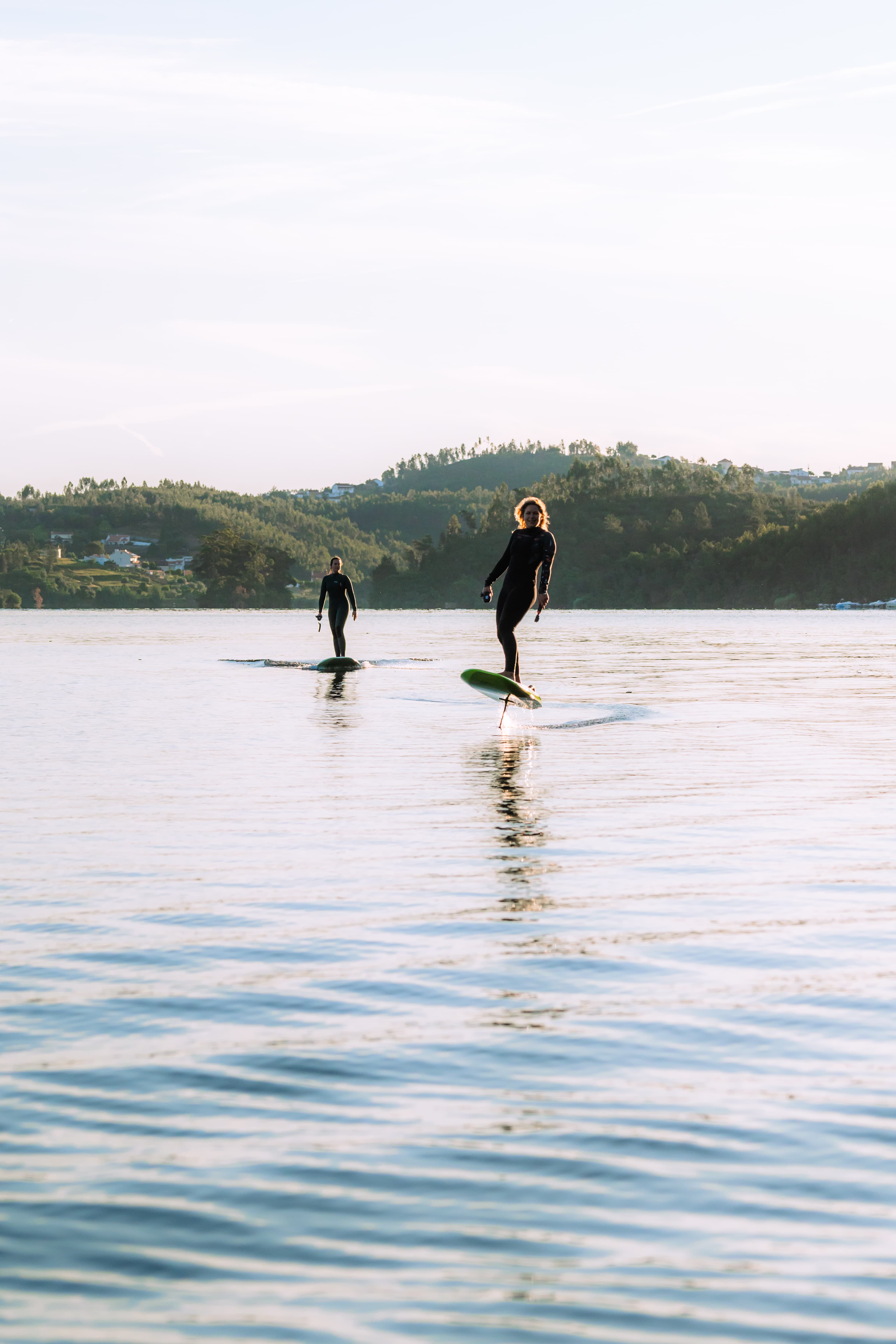 Girls eFoiling in a lake together