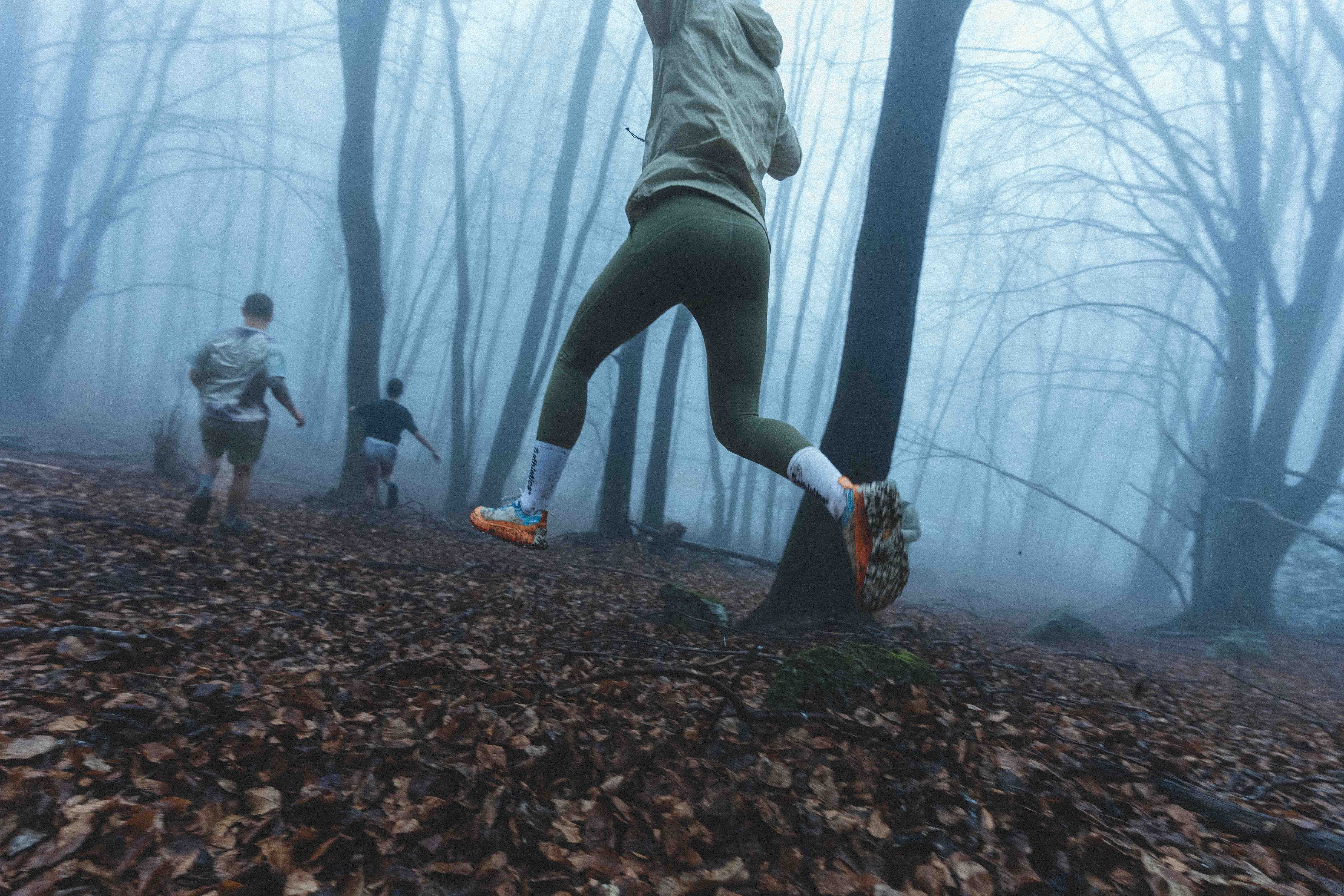 guys running in the woods